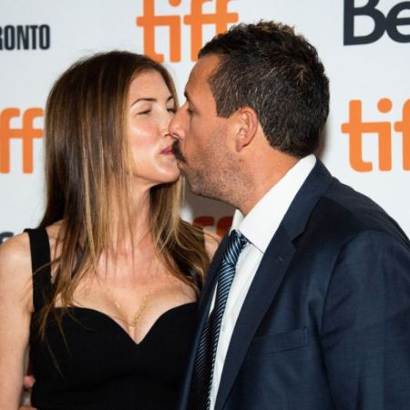 Jackie and Adam kissing each other